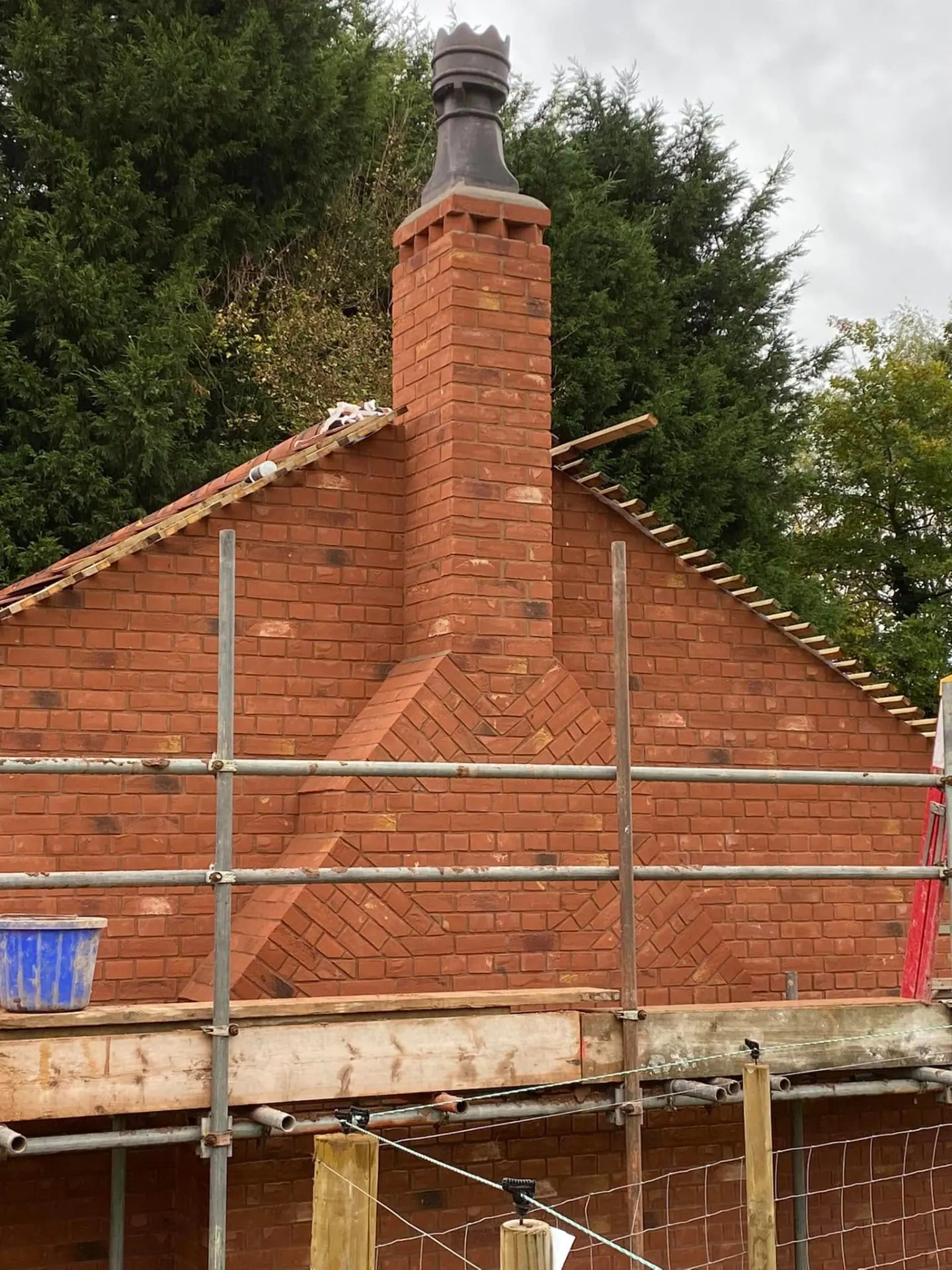Hand-laid brick chimney and herringbone gable panel, Master Bricklayer craftsmanship by JRC Developers
