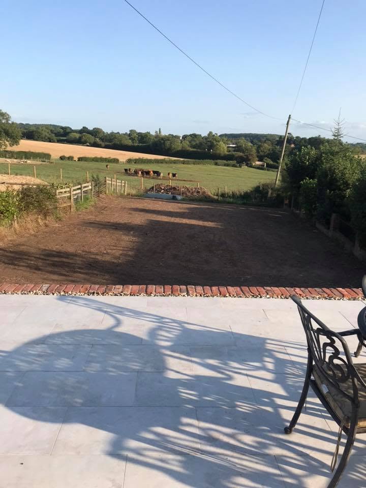 Porcelain terrace with open countryside views built alongside a heritage restoration by JRC Developers, builders in Ombersley, Worcestershire