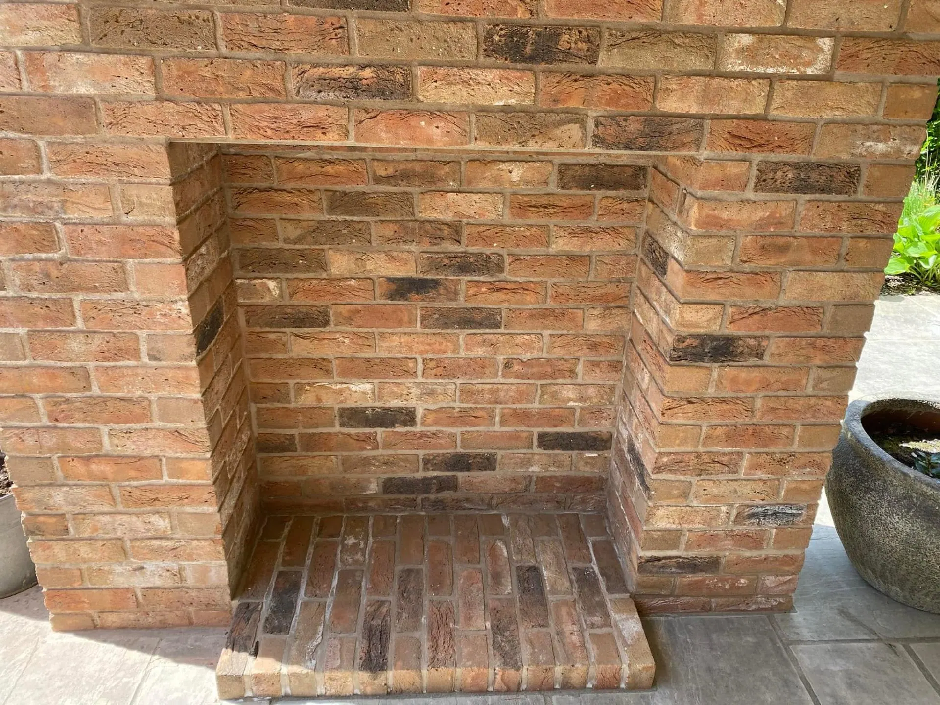 Reclaimed-brick outdoor fireplace niche at Dingleside, JRC Developers
